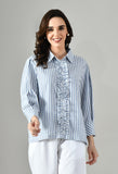 Women’s gray cotton shirt featuring a classic collar, relaxed fit, and ruffled design. Ideal for parties, office wear, or casual summer outings.