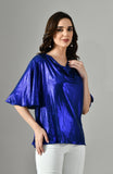 Elegant metallic lycra blue women’s top with draped neckline, paired with white trousers for modern party style