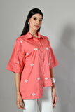 Coral shirt for women paired with white pants – formal yet trendy design inspired by Zara and Westside styles.