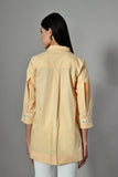 Yellow pearl-embellished tunic shirt for women – hand-embroidered summer button-down perfect for pairing with white pants.