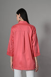 Loose fit embroidered cotton shirt in bright coral – stylish Indian fusion top for women’s fashion trends in 2025.