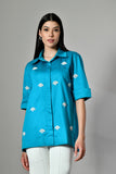 Blue pearl embellished shirt for women – breathable cotton top with hand embroidery, perfect for festive casual wear.