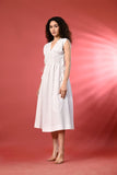 A stylish white linen dress, perfect for warm-weather occasions.