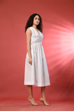 Elegant white linen dress for women, perfect for a casual summer day or evening event.