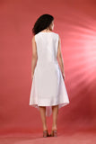 Flattering sleeveless white dress, ideal for sunny vacations and casual events.