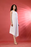 Trendy sleeveless white dress with a sleek design, perfect for summer gatherings.