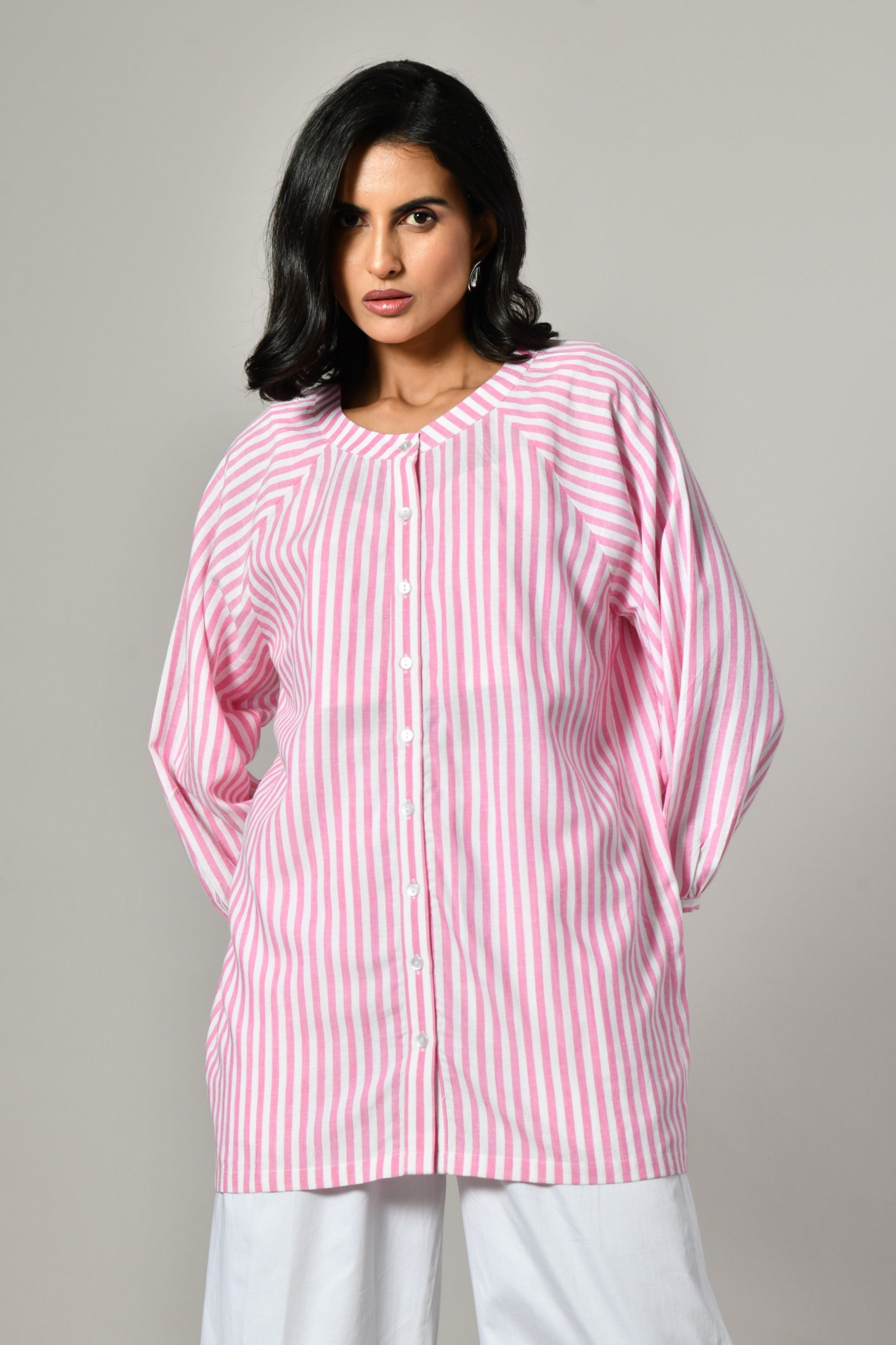 Pink and white striped tunic shirt for women – round neckline, button-front, and full sleeves in breathable cotton. 