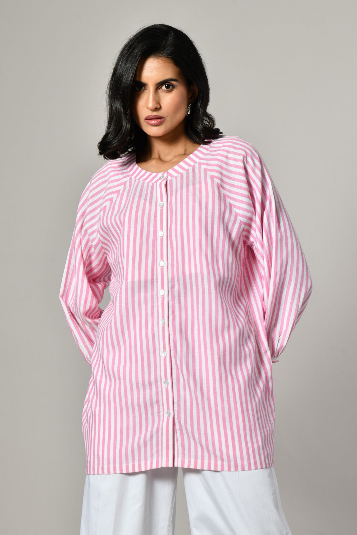 Pink and white striped tunic shirt for women – round neckline, button-front, and full sleeves in breathable cotton. 