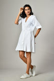 Short white summer party dress – flared shirt style with V-neck, ideal for warm weather and casual styling. 