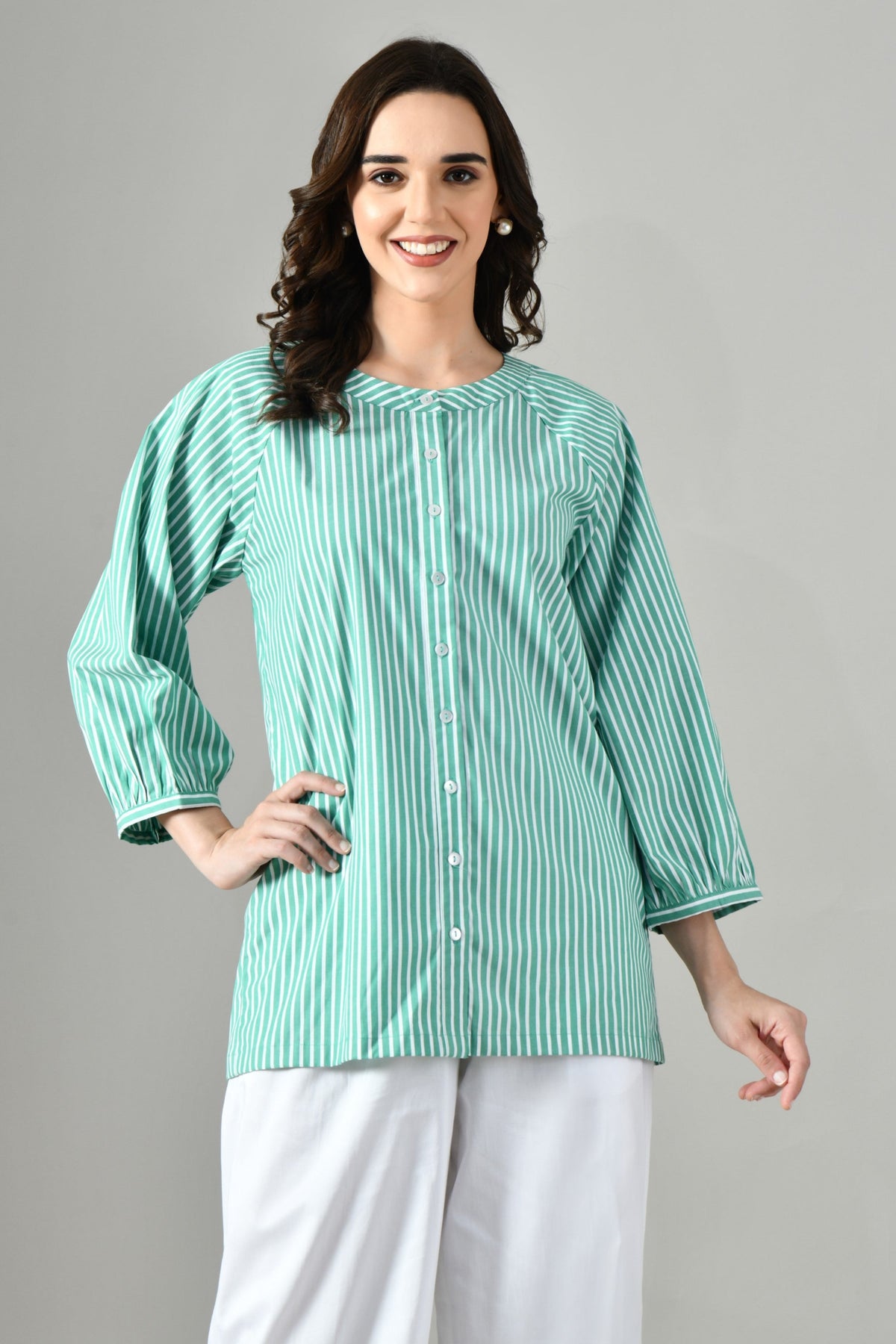 Green and white striped cotton tunic shirt for women – round neckline, button-front, and long sleeves for summer. 