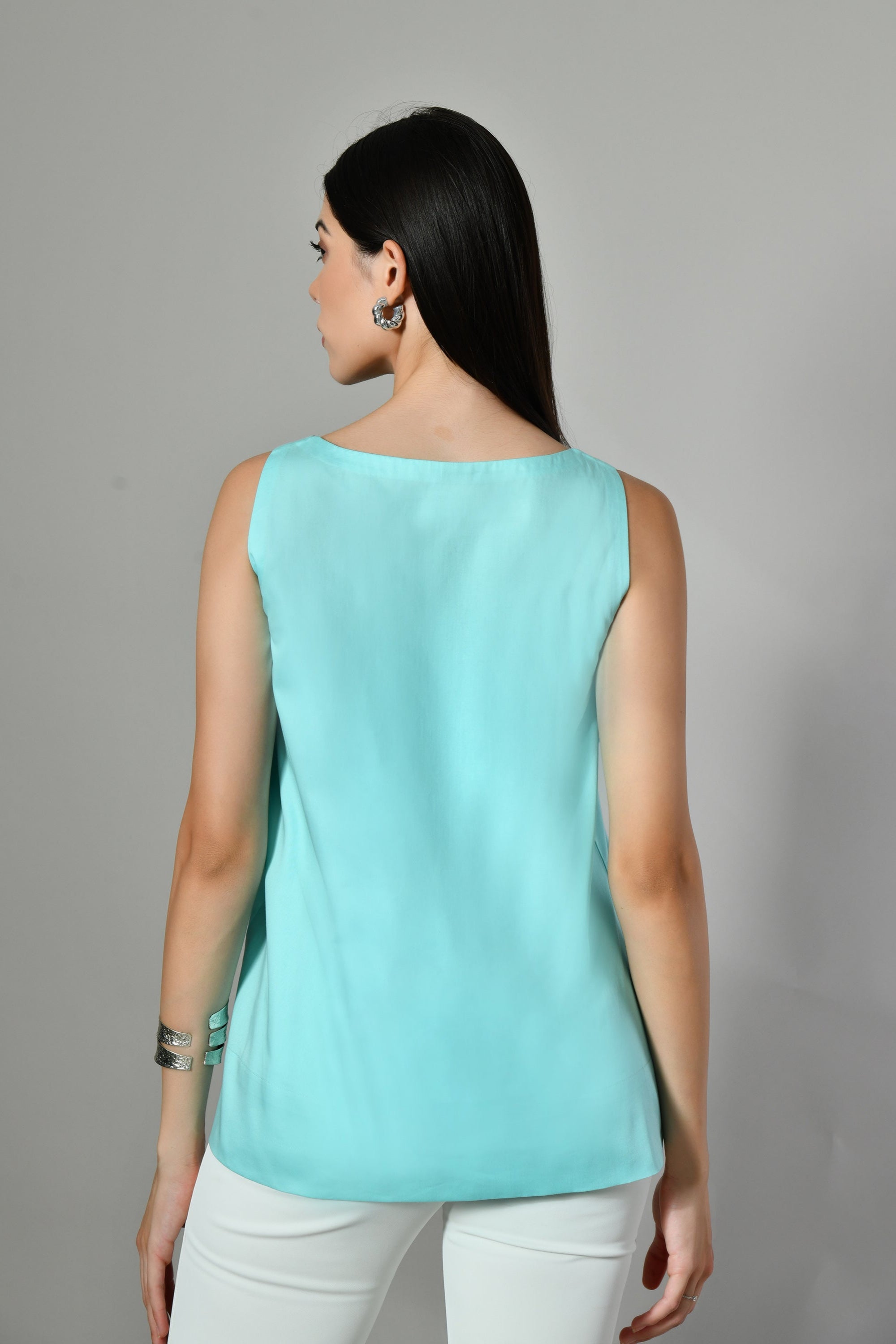 Cute round neck crop top in breathable cotton – sleeveless ladies top ideal for casual outings and summer comfort. 