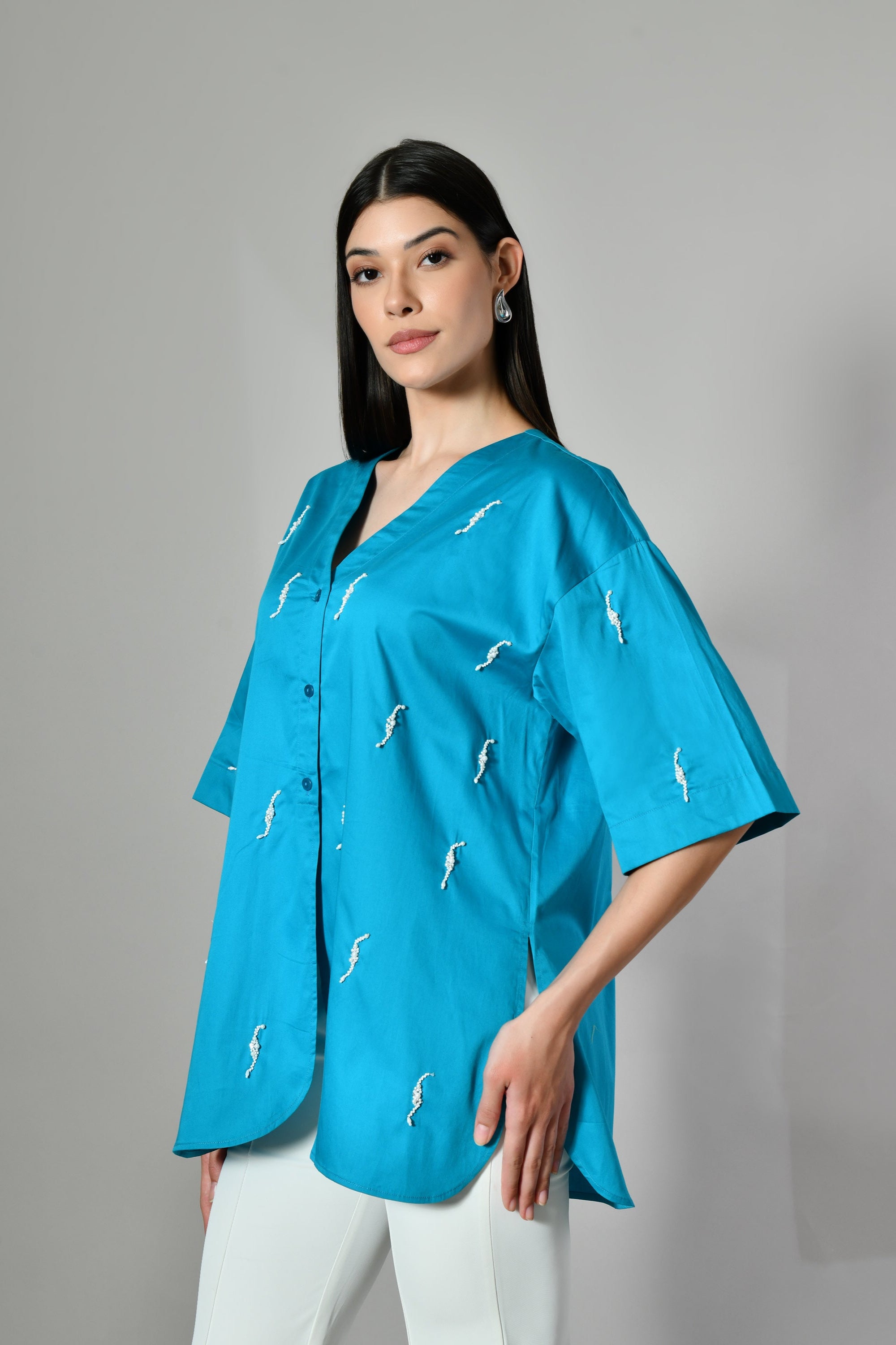 Oversized embroidered shirt for women – relaxed fit cotton top perfect for casual outings and effortless summer looks. 