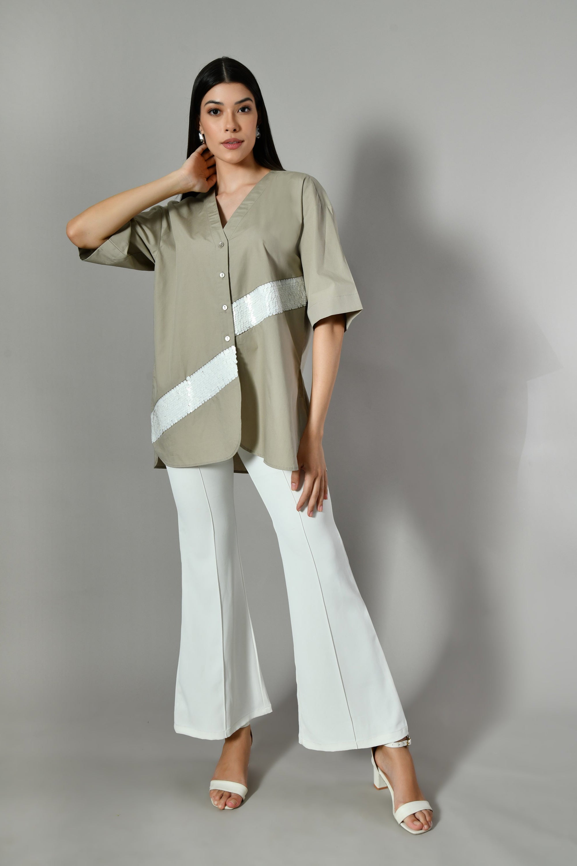 Casual gray shirt for women paired with pants – a flattering cotton staple combining shirt design trends with everyday wear.