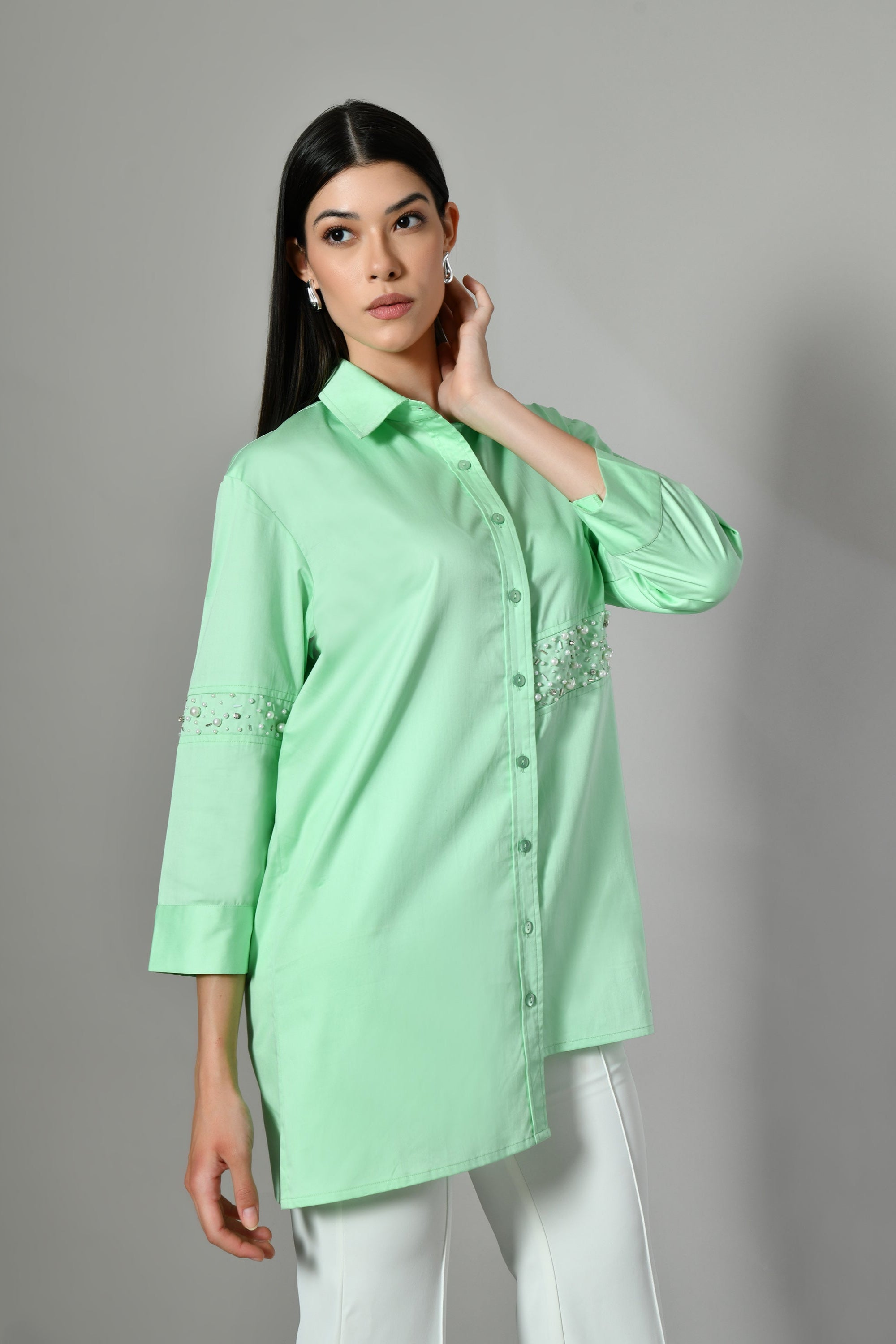 Soft green longline shirt for women – pastel cotton tunic with beaded work, perfect for office wear or everyday elegance. 