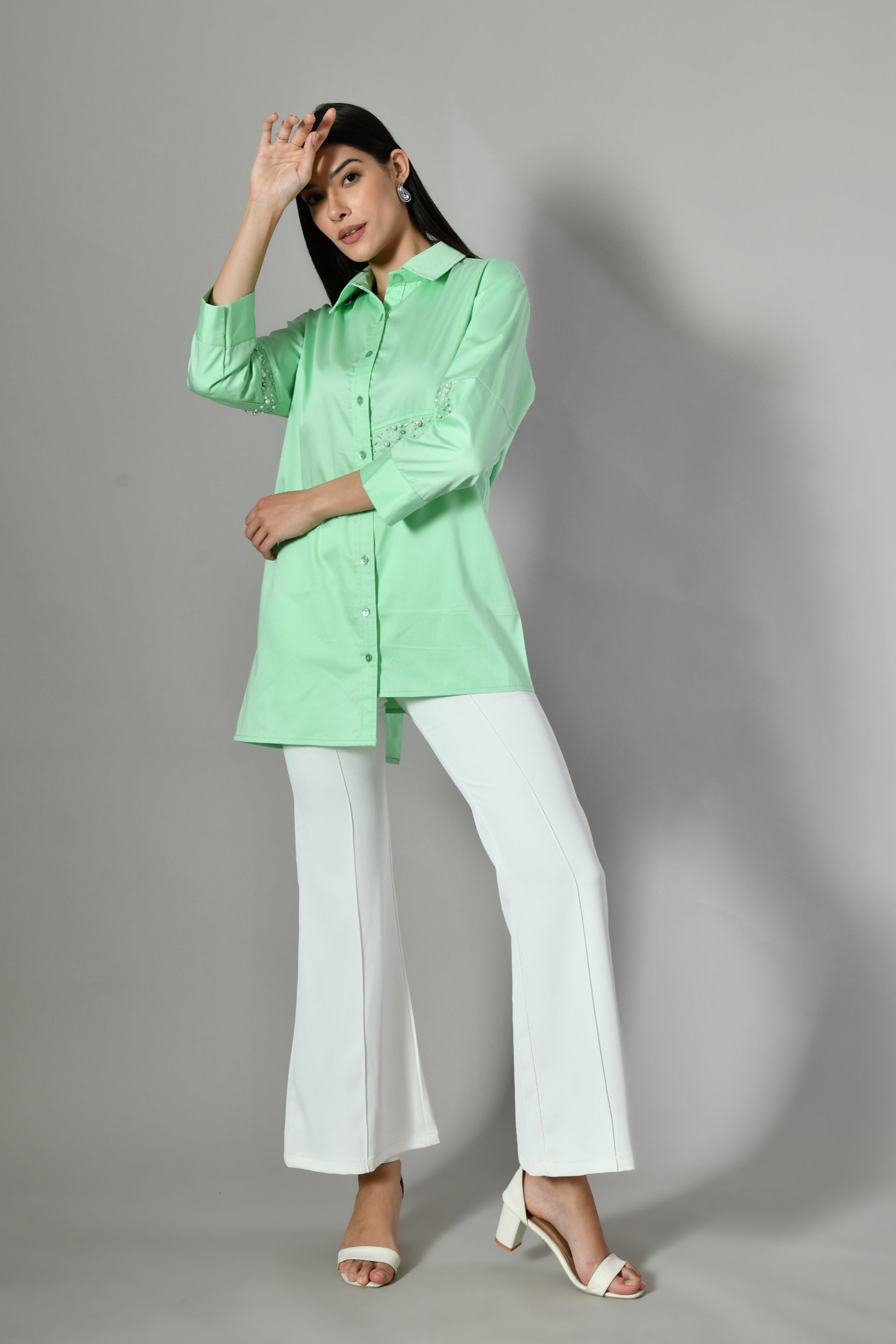 Indo-Western pastel green cotton shirt for ladies – pearl-detailed and embellished design for a refined, feminine look. 