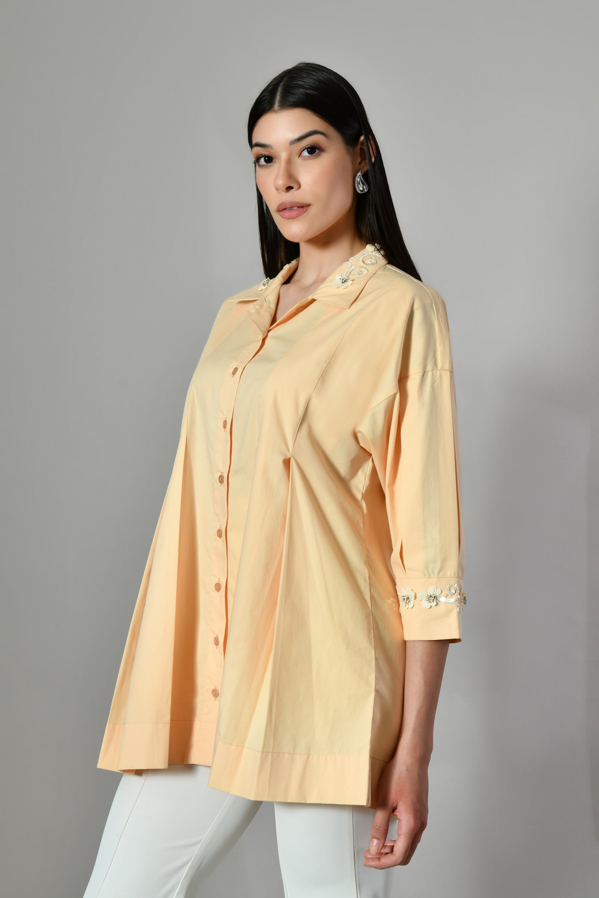 Elegant hand-embroidered yellow shirt for women – stylish summer tunic with a flattering fit, perfect for casual or office. 