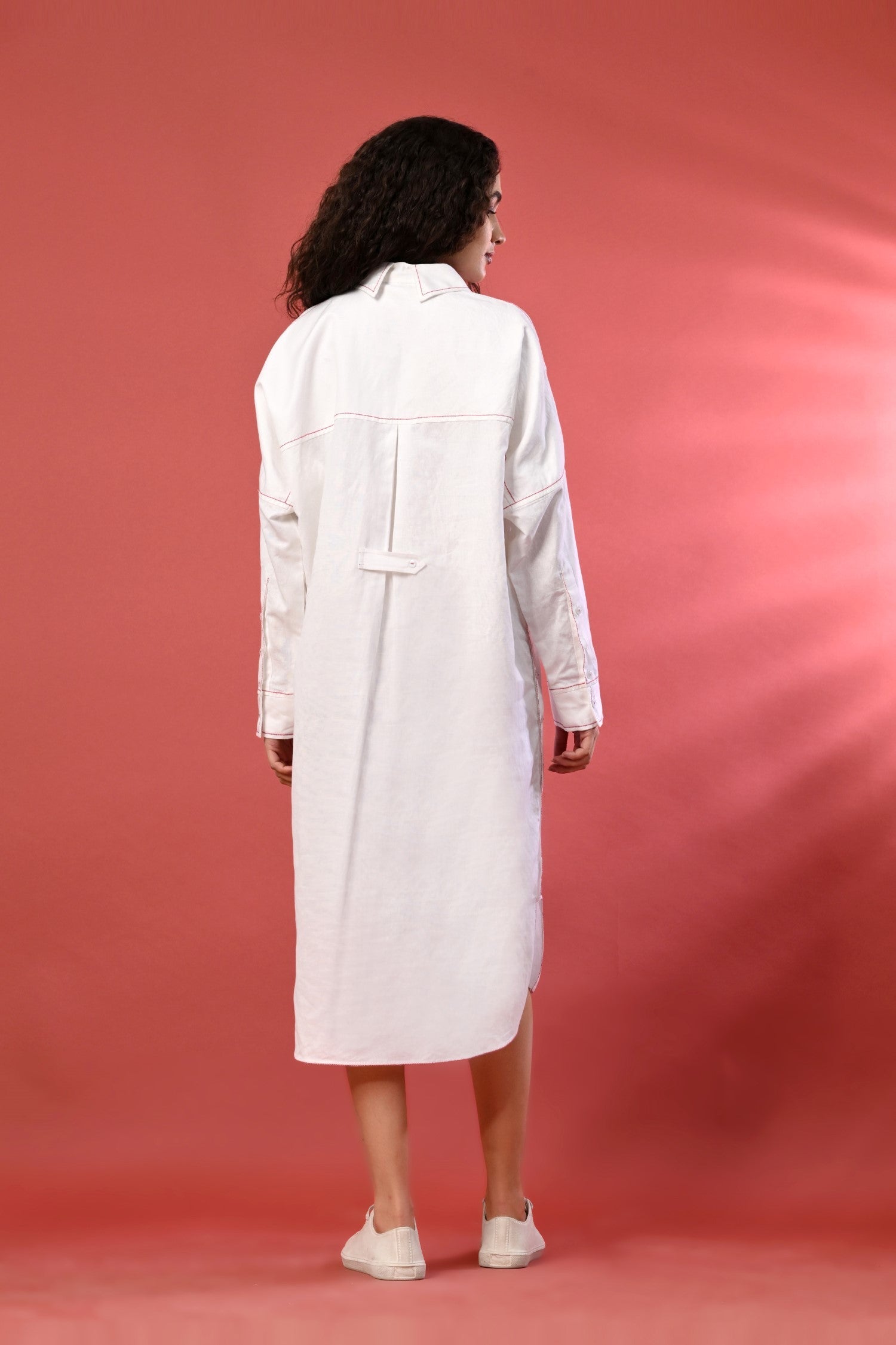Elegant women's white long shirt dress with full sleeves for hot weather.