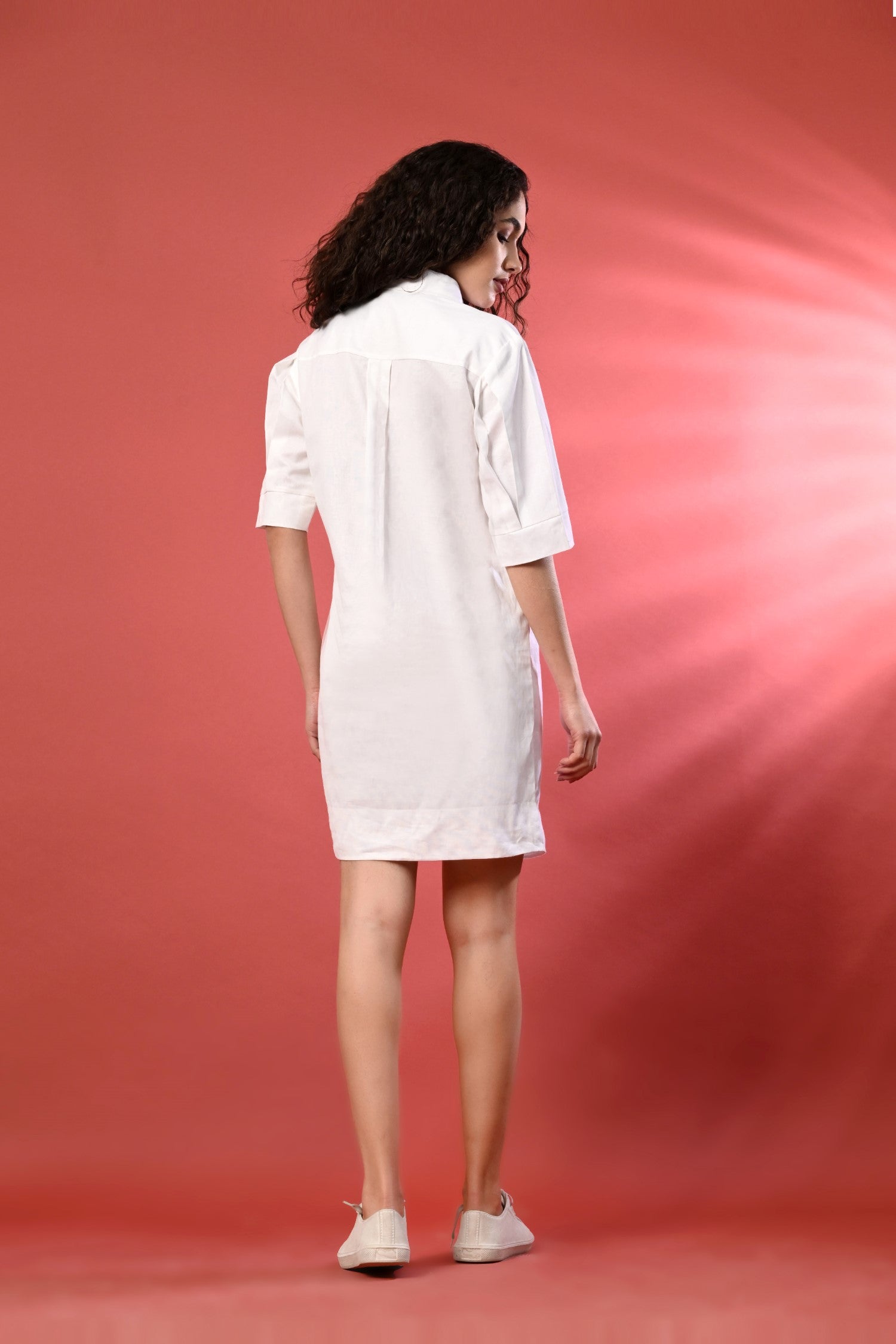 Trendy White One-Piece Summer Outfit–This fashionable dress is a go-to for white summer outfits for women combining elegance 