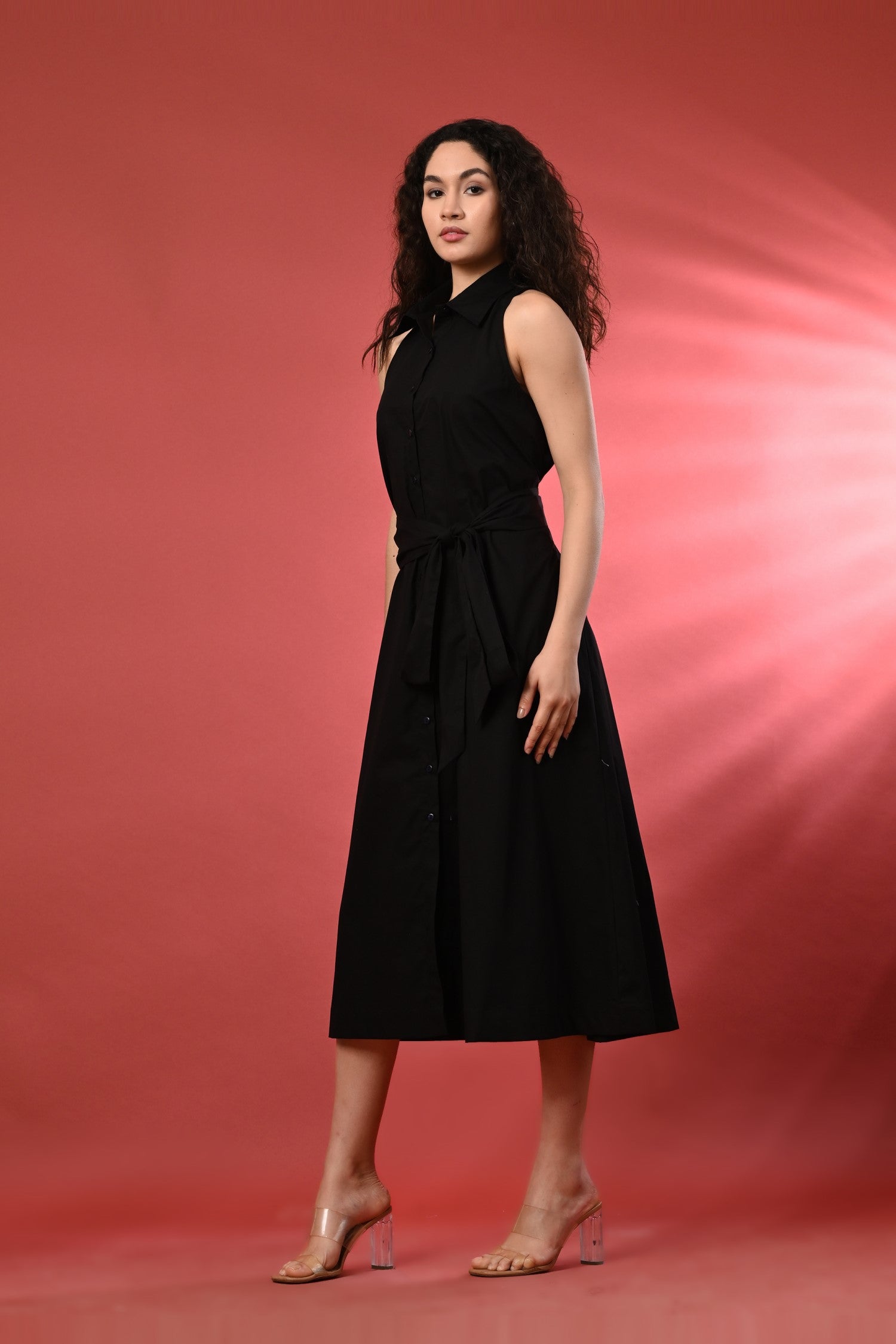 Sleek black sleeveless long dress for women, a stylish choice for cocktail parties.