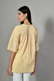 Embellished yellow button-down shirt – relaxed cotton office and festive wear for ladies. Embellished shirts online.