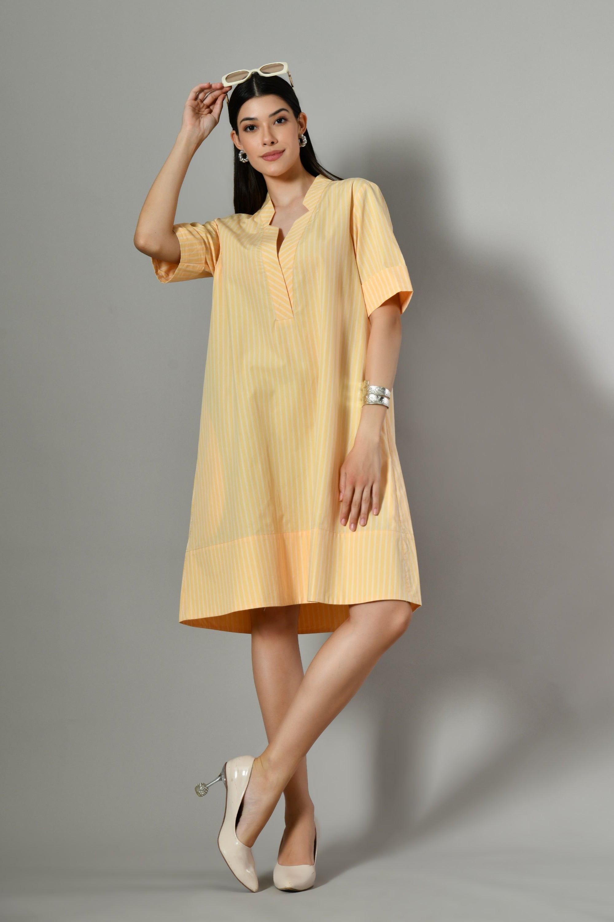 Women's yellow sundress online – elegant knee-length cotton dress from Isara, ideal for vacation wear and sunny day events. 